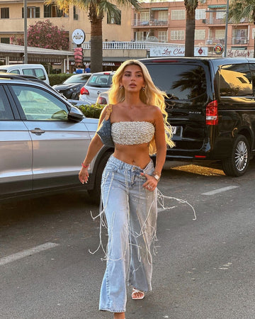 Beaded strapless top & Light blue jeans